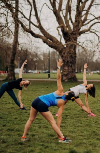 An outdoor yoga class in the park
